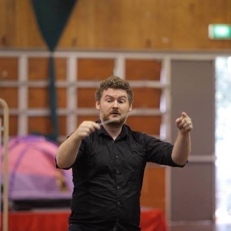 Lachlan Hamilton conducting at a workshop